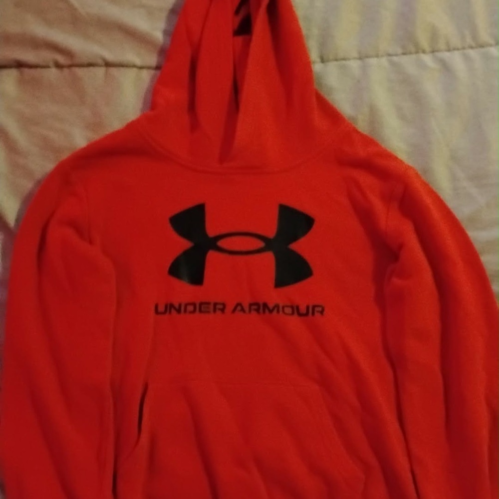 Boys red under armour hoodie with black symbol in size 7